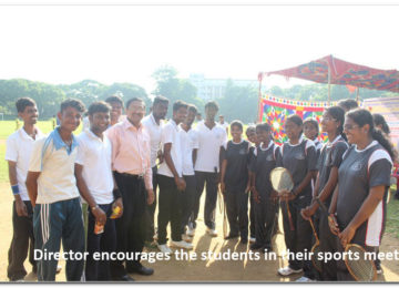 Director encourages the students in their sports meet